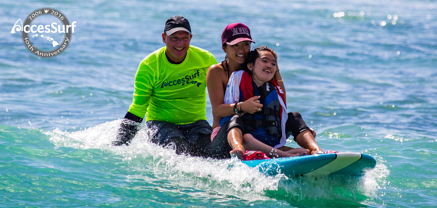 Day at the Beach image of tandem surfing in the seated position.